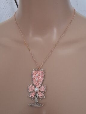 Pink Beaded Champagne Glass Pendant Necklace On A Rose Gold Chain.